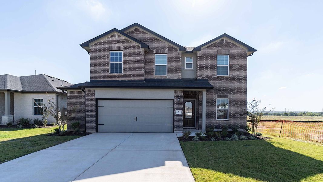 Front exterior of a new home in Briarwood, Elgin, TX, highlighting curb appeal (Image 1). Front exterior of a new home in Briarwood, Elgin, TX, highlighting curb appeal (Image 1).