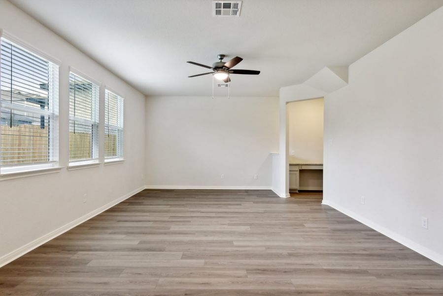 Living room in the Red River floorplan at a Meritage Homes community.