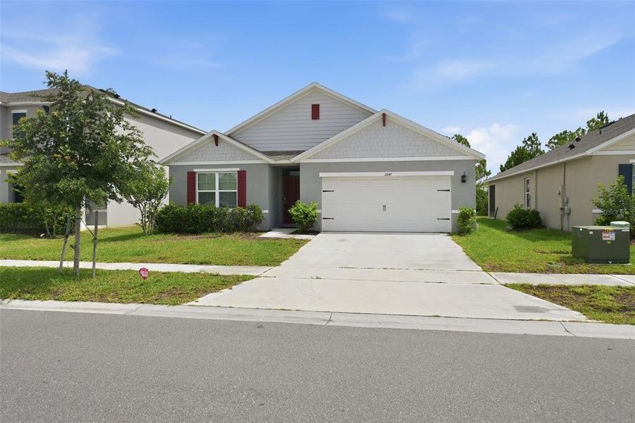 Front exterior of a new home in Harmony West, St. Cloud, FL, highlighting curb appeal (Image 21). Front exterior of a new home in Harmony West, St. Cloud, FL, highlighting curb appeal (Image 21).