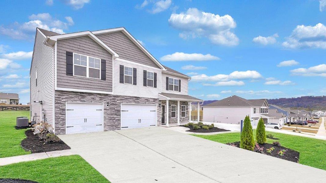 Front exterior of a new home in Sweet Briar, Ooltewah, TN, highlighting curb appeal (Image 2).