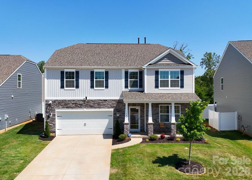 Front exterior of a new home in Wallace Springs, Statesville, NC, highlighting curb appeal (Image 24). Front exterior of a new home in Wallace Springs, Statesville, NC, highlighting curb appeal (Image 24).