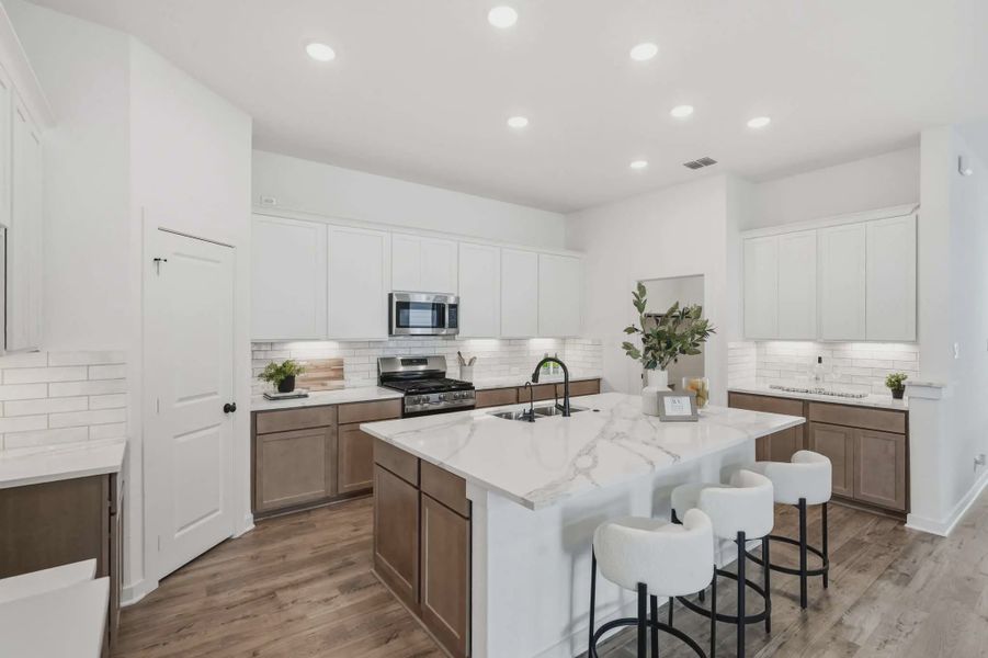 Representative furnished interior of a home built from the Tanner by Chesmar Homes in The Crossvine, Forney (Image 5).