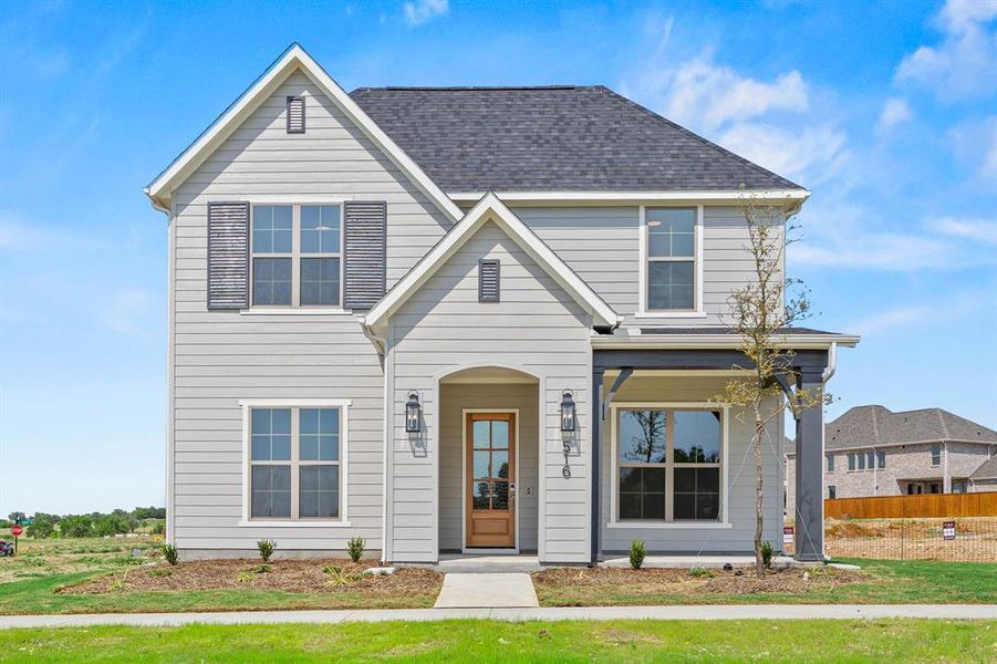 Front exterior of a new home in The Heights at Uptown Celina, Celina, TX, highlighting curb appeal (Image 2).