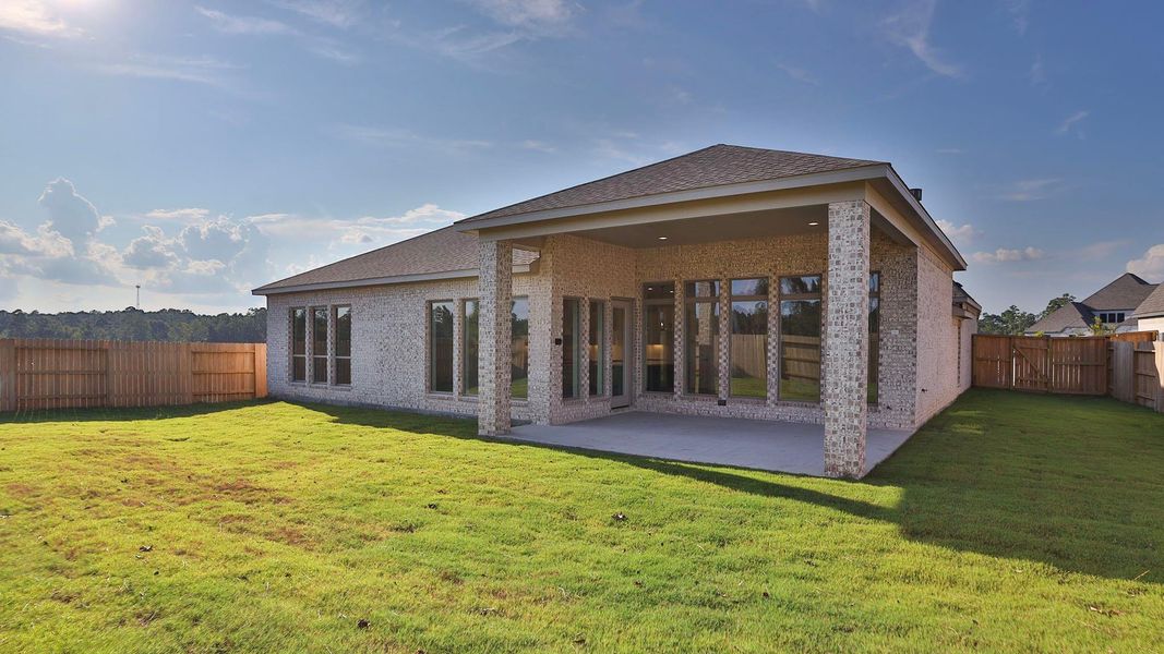 Front exterior of a new home in Evergreen 70', Conroe, TX, highlighting curb appeal (Image 2). Front exterior of a new home in Evergreen 70', Conroe, TX, highlighting curb appeal (Image 2).
