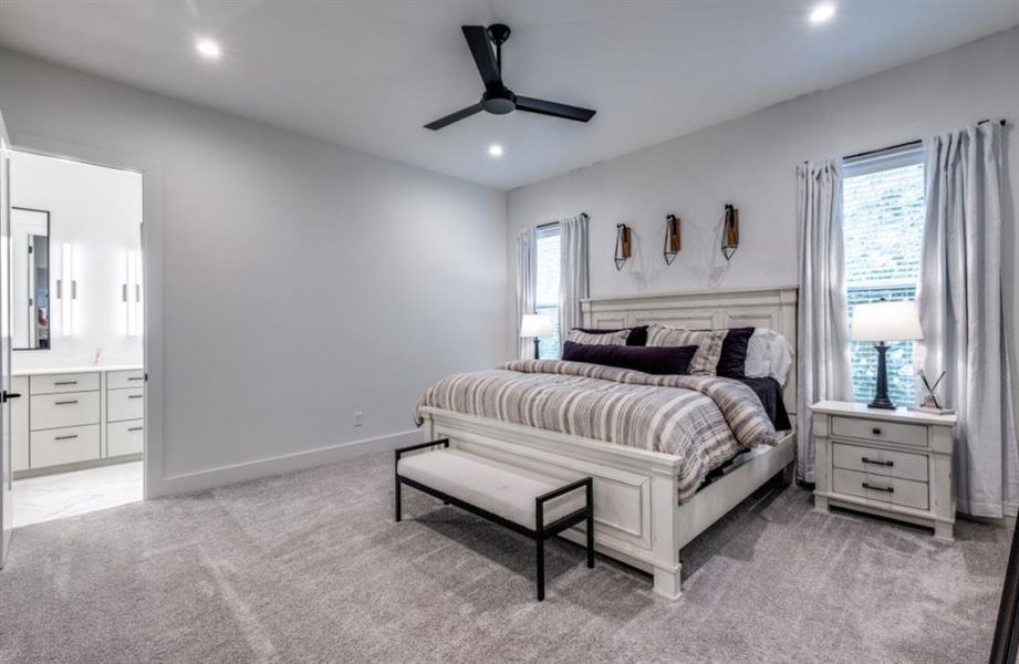 Primary bedroom featuring ensuite bathroom and 2 walk in closets