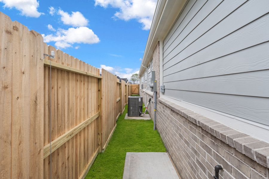 Exterior details and patio area of a home in Riceland, Mont Belvieu (Image 18).