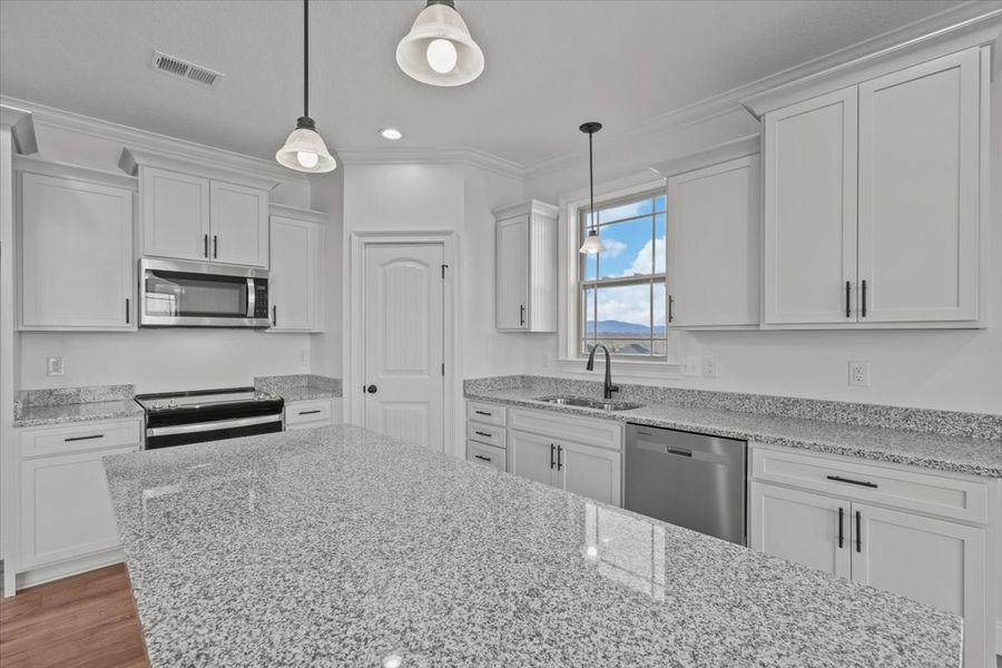 Representative furnished interior of a home built from the Converse by Enchanted Homes in Lonesome Dove, San Antonio (Image 6).