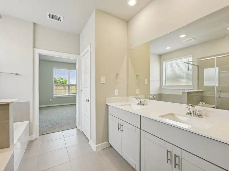 Furnished interior view inside a new home in Granger Pointe - Premier Series, Conroe (Image 12). Furnished interior view inside a new home in Granger Pointe - Premier Series, Conroe (Image 12).