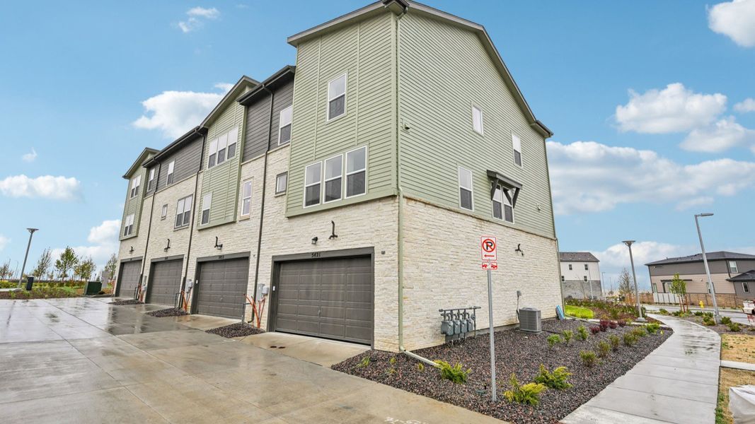 Front exterior of a new home in Windler Townhomes, Aurora, CO, highlighting curb appeal (Image 22). Front exterior of a new home in Windler Townhomes, Aurora, CO, highlighting curb appeal (Image 22).