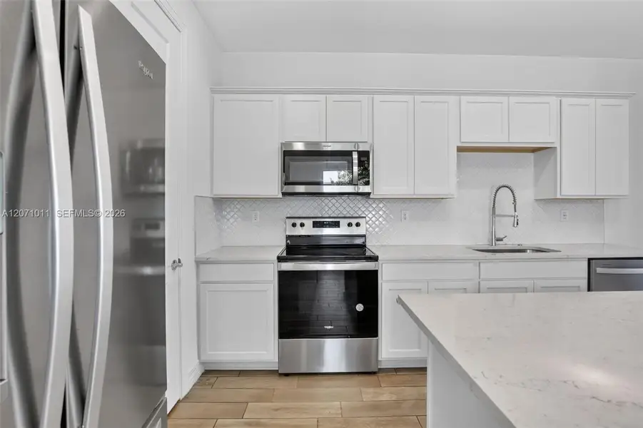 Furnished interior view inside a new home in , Plantation (Image 11).