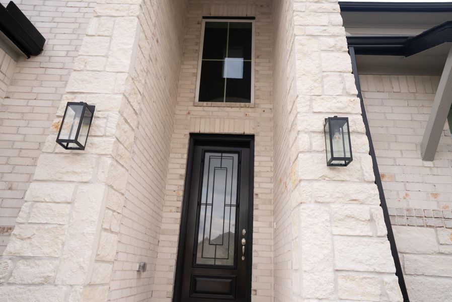 Exterior details and patio area of a home in Sunterra, Katy (Image 3). Exterior details and patio area of a home in Sunterra, Katy (Image 3).