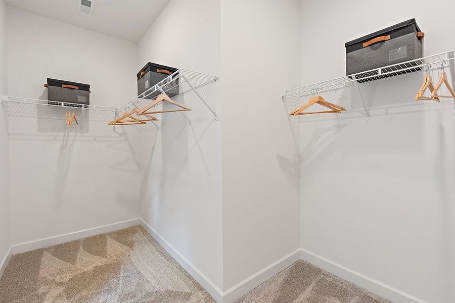 A room with a white wall and a white wall with a black box and a black box on. A room with a white wall and a white wall with a black box and a black box on.