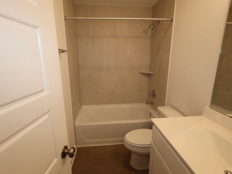 Furnished interior view inside a new home in Pinewood at Grand Texas, New Caney (Image 13).