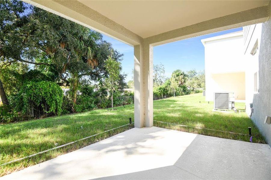 Exterior details and patio area of a home in Seasons at Shores of Lake Dell, Dundee (Image 15).