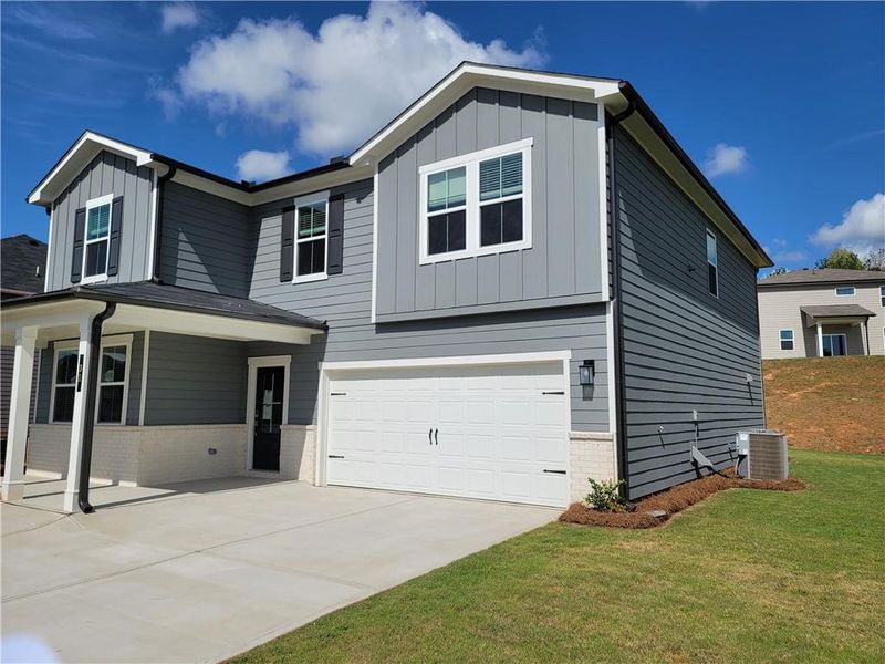 Front exterior of a new home in Reserve at Gum Springs, Jefferson, GA, highlighting curb appeal (Image 1). Front exterior of a new home in Reserve at Gum Springs, Jefferson, GA, highlighting curb appeal (Image 1).