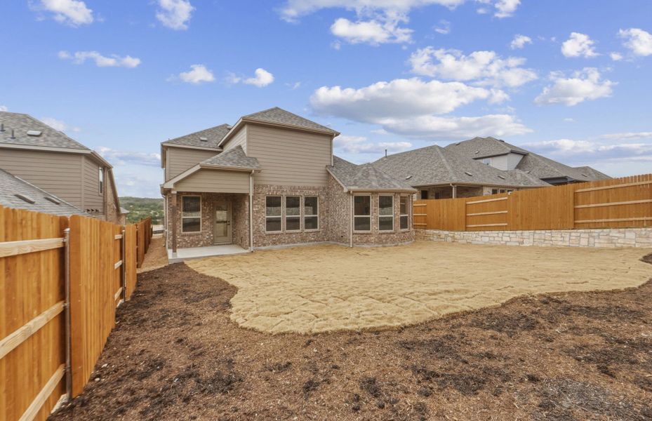 Exterior details and patio area of a home in West Cypress Hills, Spicewood (Image 32).