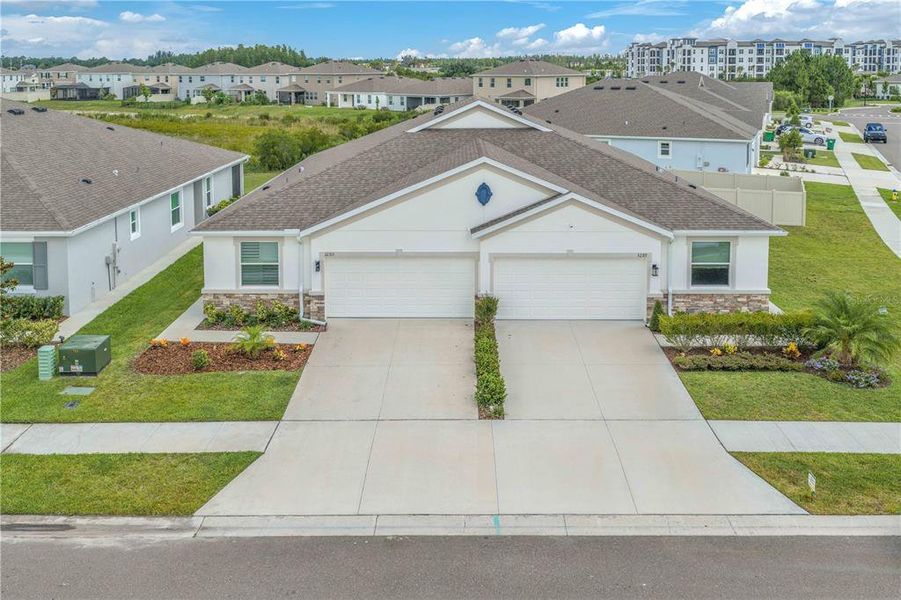 Front exterior of a new home in , Wesley Chapel, FL, highlighting curb appeal (Image 2). Front exterior of a new home in , Wesley Chapel, FL, highlighting curb appeal (Image 2).