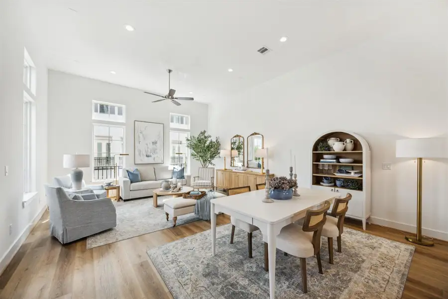 Spacious open, living/dining/Kitchen with 14 foot high ceilings, lots of windows, and gorgeous 7 inch vinyl hardwoods. Spacious open, living/dining/Kitchen with 14 foot high ceilings, lots of windows, and gorgeous 7 inch vinyl hardwoods.