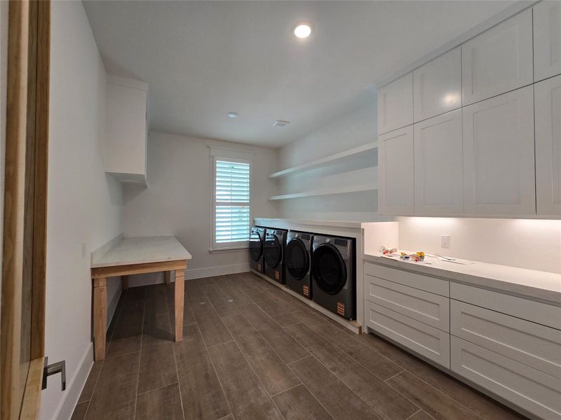 Laundry with 2 washers and 2 dryers.