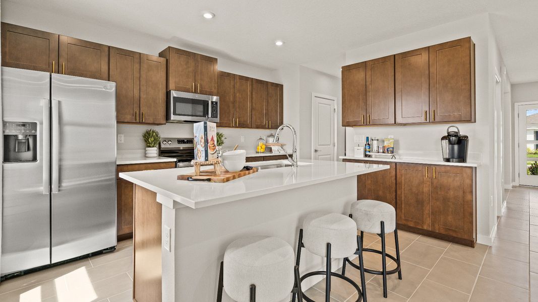 The Kitchen in the Model Highbourne by DRB Homes in Hamilton Bluff located in Haines City, FL. The Kitchen in the Model Highbourne by DRB Homes in Hamilton Bluff located in Haines City, FL.