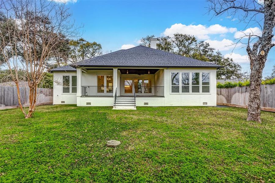 This large outdoor space features mature trees and a lush lawn. A dream for the gardener, an outdoor enthusiast, a pool or a playscape!