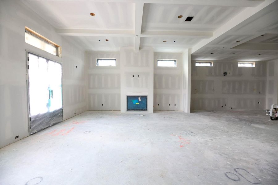 This great Family Room is perfect for entertaining and offers much space for large furniture layouts. Custom built-ins on either side of fireplace.