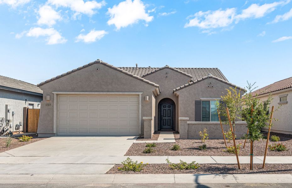Front exterior of a new home in El Cidro, Goodyear, AZ, highlighting curb appeal (Image 2). Front exterior of a new home in El Cidro, Goodyear, AZ, highlighting curb appeal (Image 2).