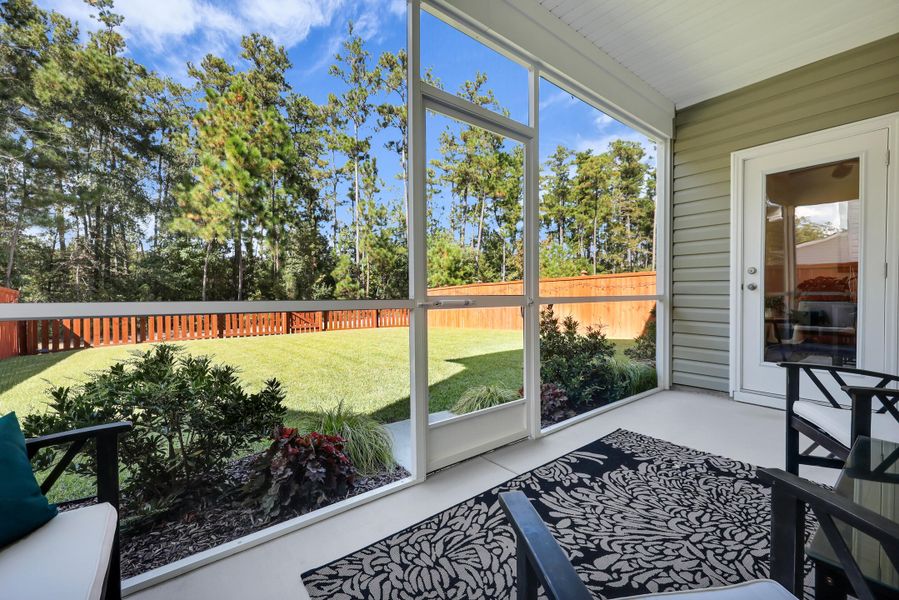 Exterior details and patio area of a home in Jasmine Point at Lakes of Cane Bay, Summerville (Image 2).