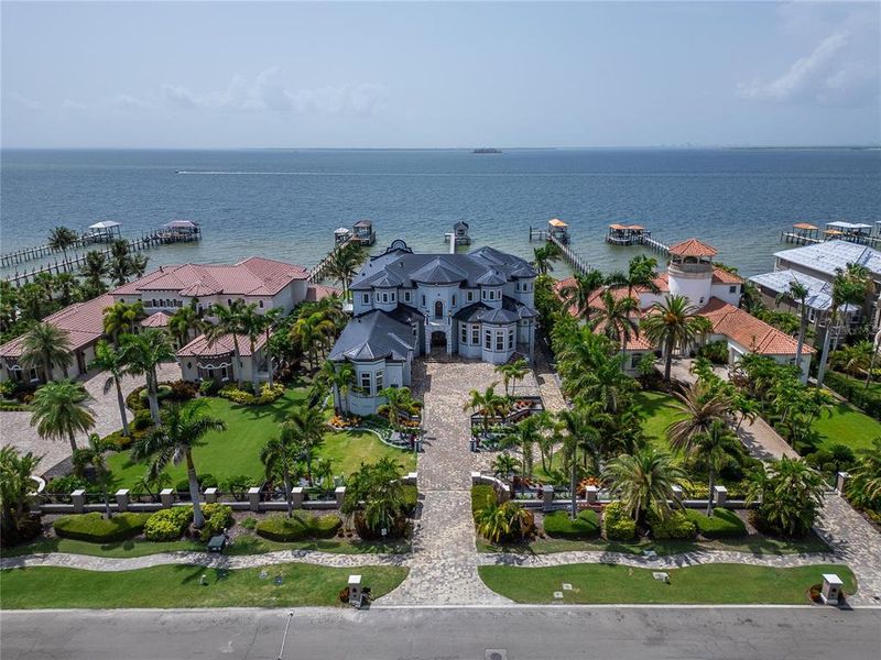Front exterior of a new home in , Apollo Beach, FL, highlighting curb appeal (Image 1).