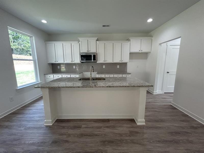 Furnished interior view inside a new home in Sutton's Landing, Statham (Image 6).