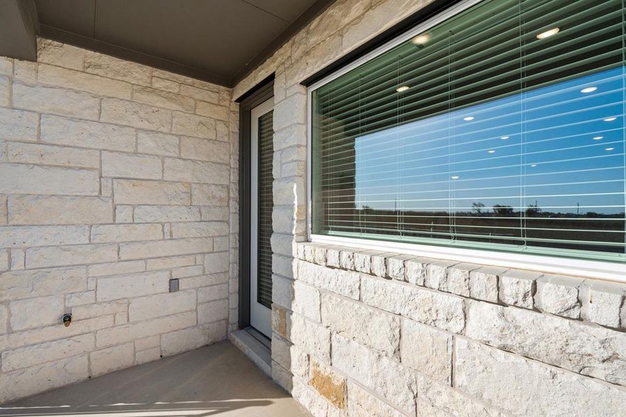 Exterior details and patio area of a home in Union Collection at Park Central, Georgetown (Image 27).