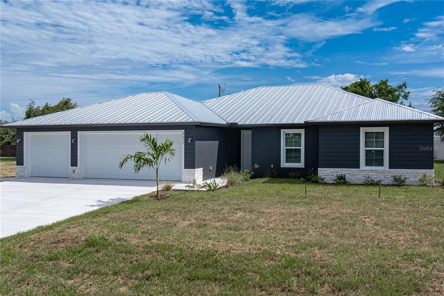 Front exterior of a new home in , Englewood, FL, highlighting curb appeal (Image 23).