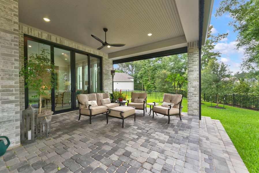 Upgraded sliding doors connect the main living area directly to the covered patio. This seamless transition supports indoor-outdoor entertaining and makes the backyard feel like a true extension of the home.