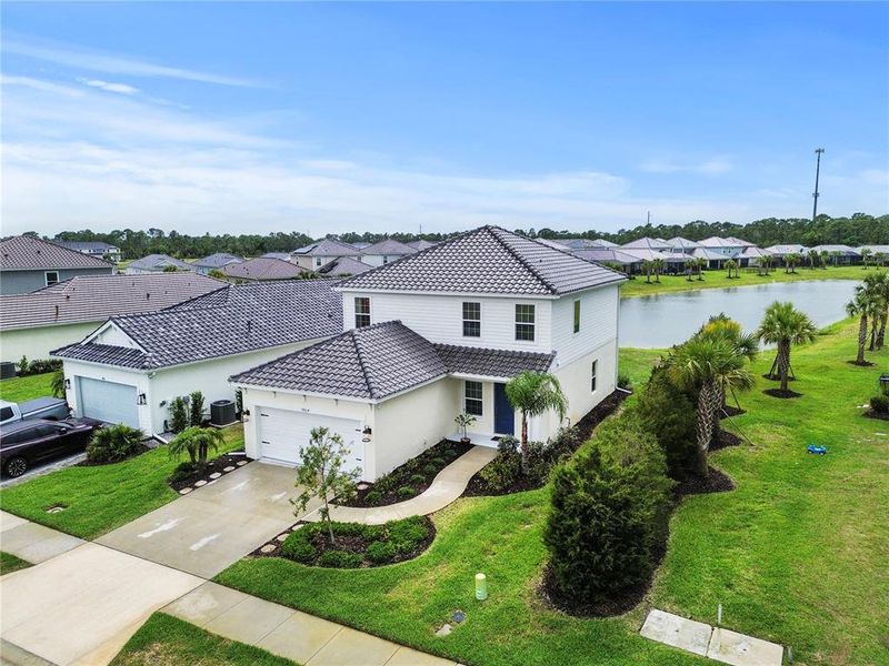 Front exterior of a new home in , Sarasota, FL, highlighting curb appeal (Image 25).