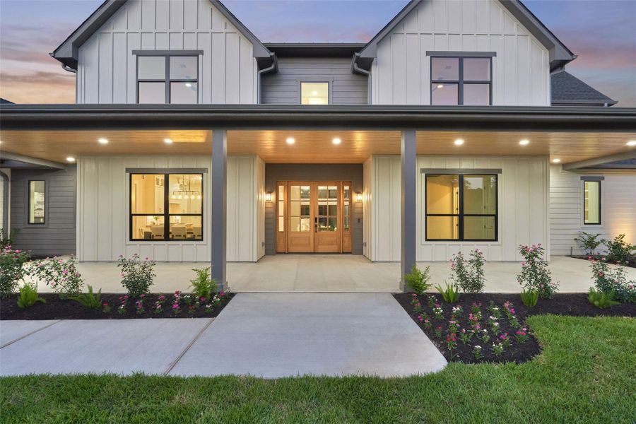 Picture yourself walking up to this every single evening — warm light, a welcoming porch, and a front door that says you've arrived somewhere special Picture yourself walking up to this every single evening — warm light, a welcoming porch, and a front door that says you've arrived somewhere special