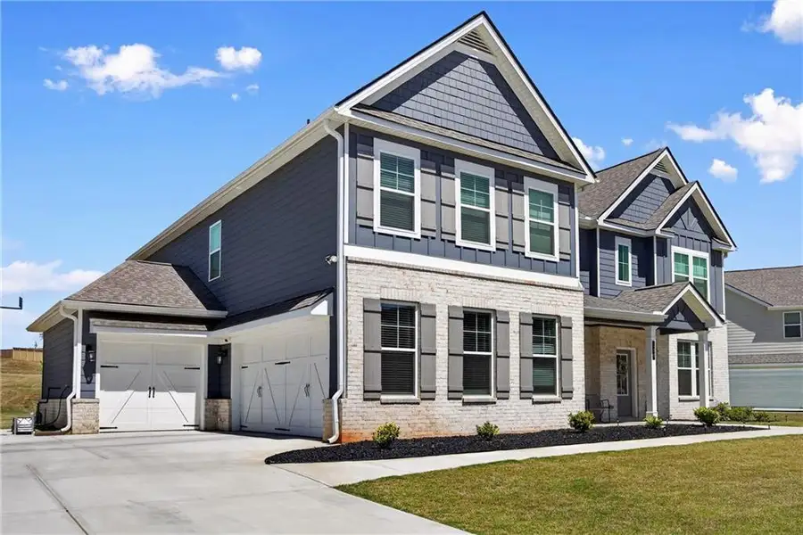Front exterior of a new home in , Stockbridge, GA, highlighting curb appeal (Image 22).