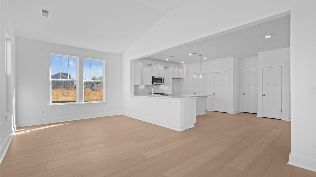 Eye-catching morning room with elegant trim, oversized windows, and elevated design