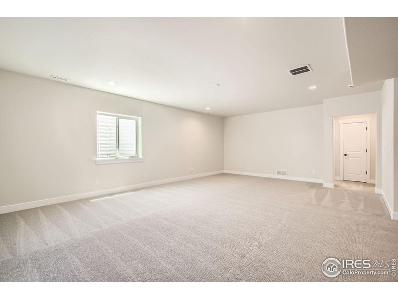 Spacious, unfurnished interior of a new home in RainDance National 60/70, Windsor (Image 18).
