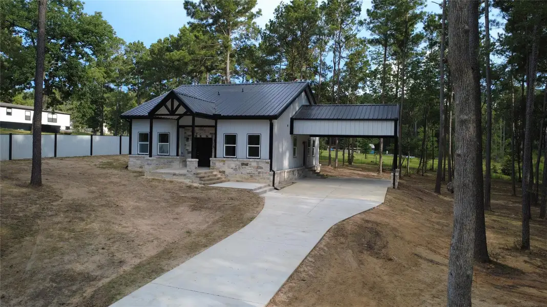 Front exterior of a new home in , Navasota, TX, highlighting curb appeal (Image 15).