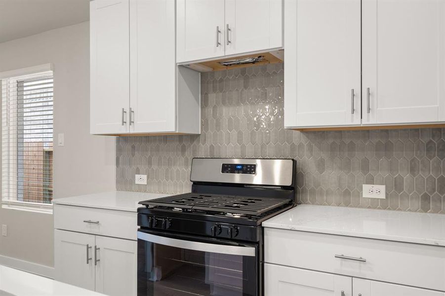 Enjoy the perks of a BRAND NEW kitchen with Stainless Steel appliances, quartz countertops and sleek white cabinetry!