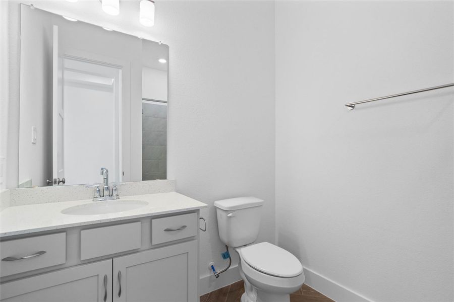 This well-appointed secondary bathroom offers exceptional functionality with its stained cabinet, light countertop and convenient undermount sink. The walk-in shower with tile surround and built in shelf are all finished with sleek, polished fixtures. This well-appointed secondary bathroom offers exceptional functionality with its stained cabinet, light countertop and convenient undermount sink. The walk-in shower with tile surround and built in shelf are all finished with sleek, polished fixtures.