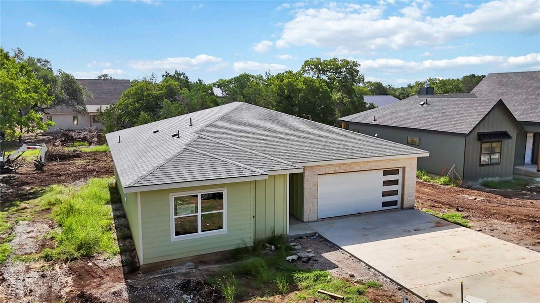 Front exterior of a new home in , Wimberley, TX, highlighting curb appeal (Image 1). Front exterior of a new home in , Wimberley, TX, highlighting curb appeal (Image 1).