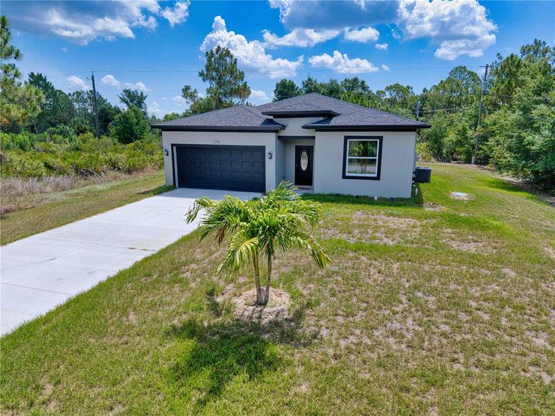 Front exterior of a new home in , Port Charlotte, FL, highlighting curb appeal (Image 22). Front exterior of a new home in , Port Charlotte, FL, highlighting curb appeal (Image 22).