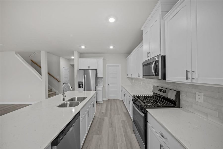 Furnished interior view inside a new home in The Farm at Wells Creek - Signature Collection, Gray Court (Image 7).