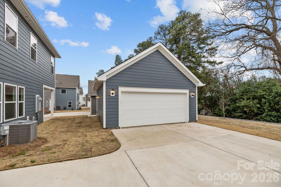 Front exterior of a new home in Arbor Village, Matthews, NC, highlighting curb appeal (Image 19).