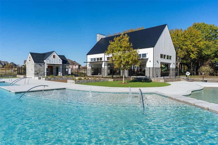 The gorgeous resort style pool area features a main pool with tanning ledges along with a splash zone for the kids creating fun times for all members of the family!