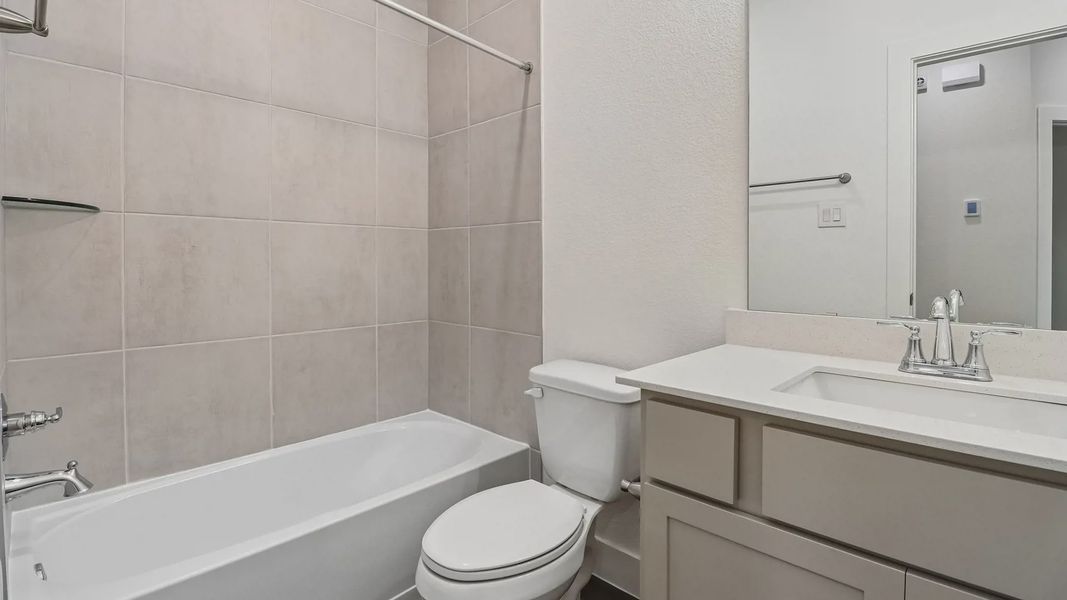 Furnished interior view inside a new home in Meridiana Townhomes, Manvel (Image 17).