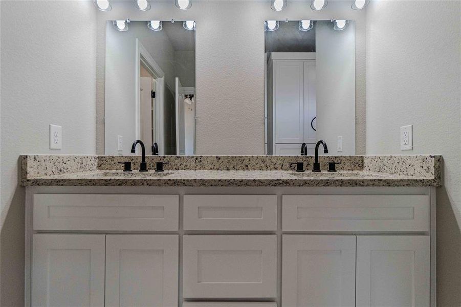 Bathroom featuring double vanity