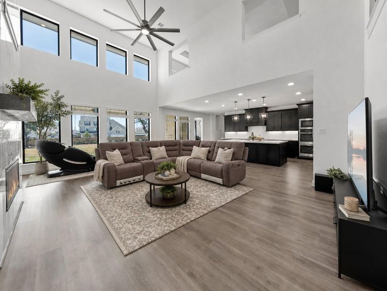 A grand, open living area showcases tall ceilings and abundant natural light. A grand, open living area showcases tall ceilings and abundant natural light.