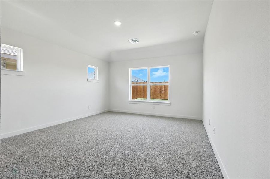 Spare room with carpet and baseboards Spare room with carpet and baseboards